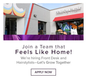 A modern hair salon with colorful exterior signage advertises job openings for front desk staff and hairstylists, inviting applicants to join their team.